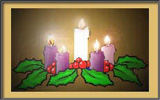 Advent wreath with central candle lit.